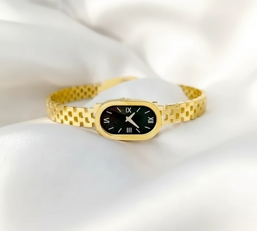 Gold watch in morning light