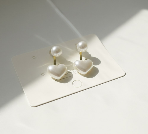 Pearl Heart Earrings with White Background and Natural Sunlight